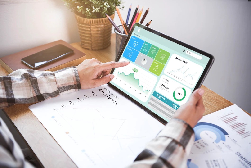 Businesswoman using table analysis graph